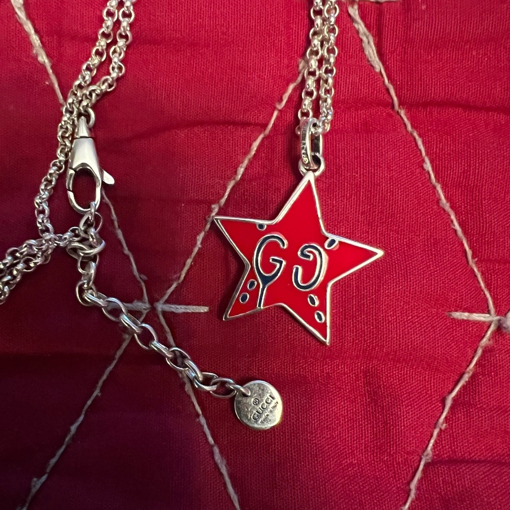 Gucci red ghost pendant and necklace.